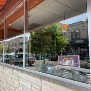 Commercial storefront window cleaned by Wizards Window Washing